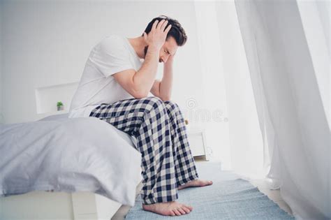 Photo Of Sad Unhappy Mature Guy Dressed Sleepwear Feeling Head Pain Sitting Bed Indoors Room