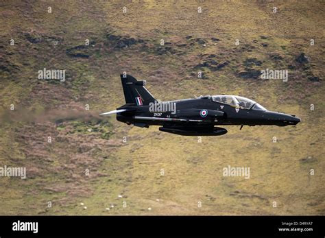 A Hawk T2 jet trainer aircraft of the Royal Air Force low flying over ...