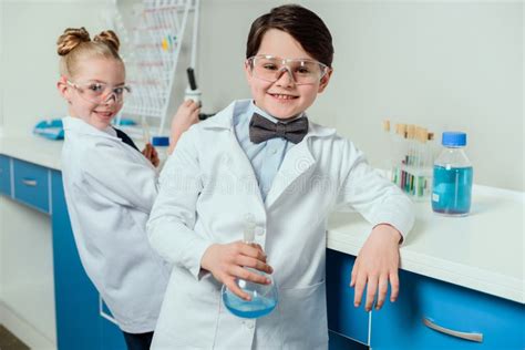 Schoolchildren With Science Lab Equipment In Chemical Lab Stock Photo