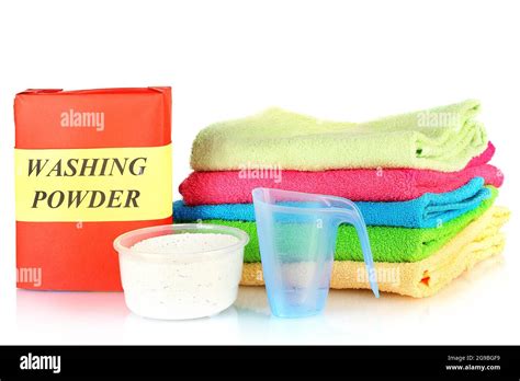 Box Of Washing Powder With Blue Measuring Cup And Towels Isolated On