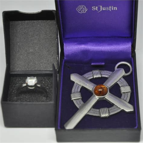 Solitaire Ring And St Justin Robin Of Locksley Cross Pendant