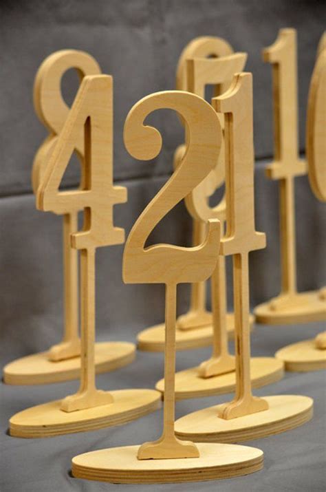 Wooden Numbers Are Lined Up On Pedestals To Form The Number Twenty