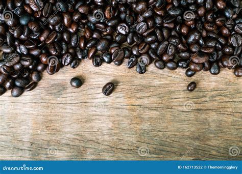 Roast Coffee Bean On Wooden Table Frame With Copy Space Stock Photo