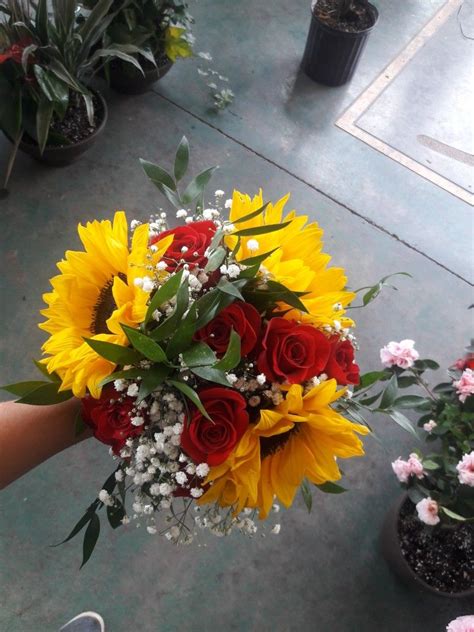 Bridesmaid Bouquet Using Red Roses Sunflowers Ruscus And Babys