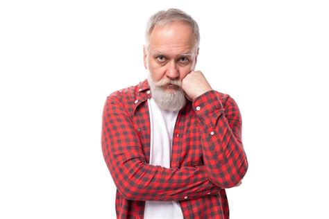 Premium Photo Mature Sullen Grayhaired Man With A Beard In A Red Shirt