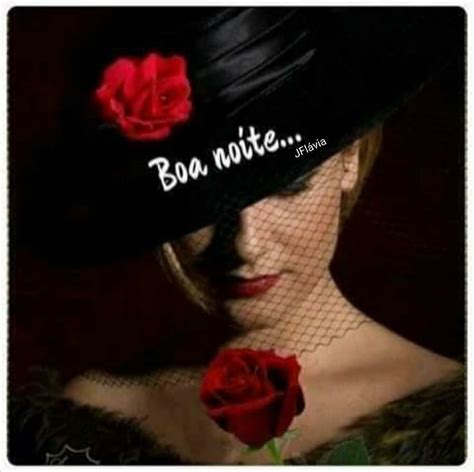 A Woman Wearing A Black Hat With Red Roses On It