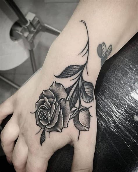 101 Amazing Rose Hand Tattoo Ideas [2024 Inspiration Guide] Rose Hand