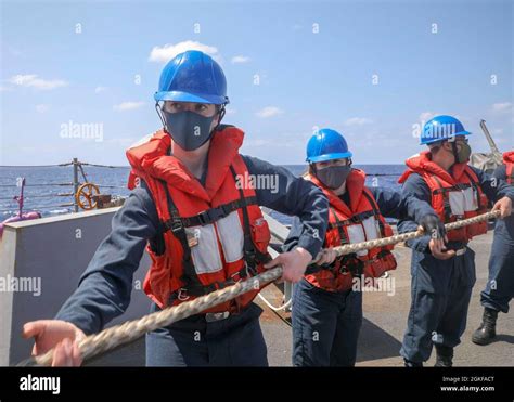 Philippine Sea April Sailors Heave A Line On The Fantail Of