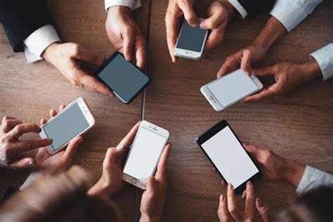 Office Workers Work On Phones Mobile Meeting Concept Close Up Of