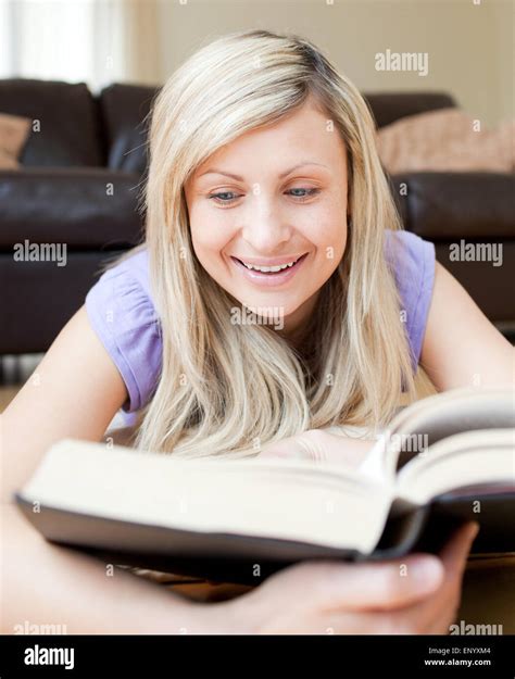 Happy woman reading a book Stock Photo - Alamy