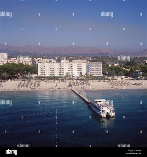 Aerial View Of Puerto Alcudia Beach With Pleasure Boat In The Bay