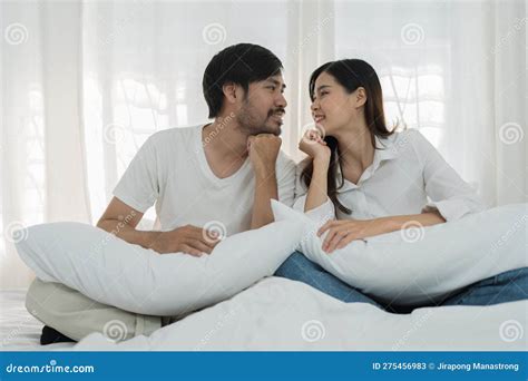 Asian Romantic Couple In Bed Enjoying Sensual Foreplay Happy Sensual Young Couple Lying In Bed