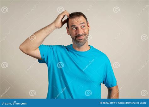 Doubtful Bearded Latin Man Thinking Scratching His Head And Trying To