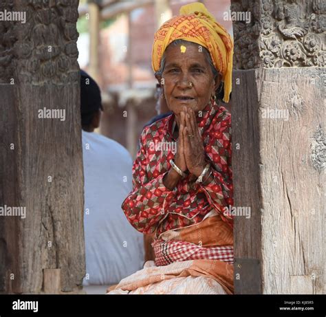 Woman on temple step greeting Namaste, Kathmandu, Nepal Stock Photo - Alamy