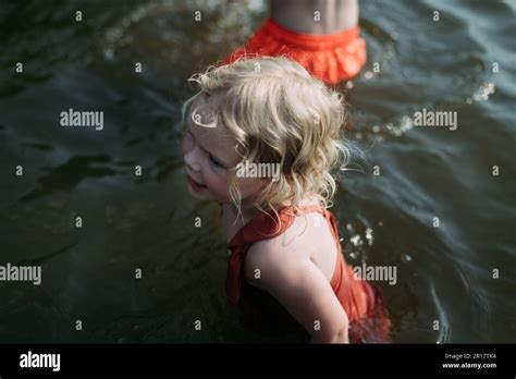 Kids swimming in lake during summer Stock Photo - Alamy