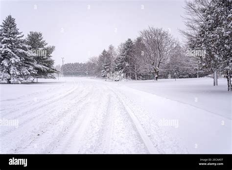 Snow Covered Suburban Street Stock Photo Alamy