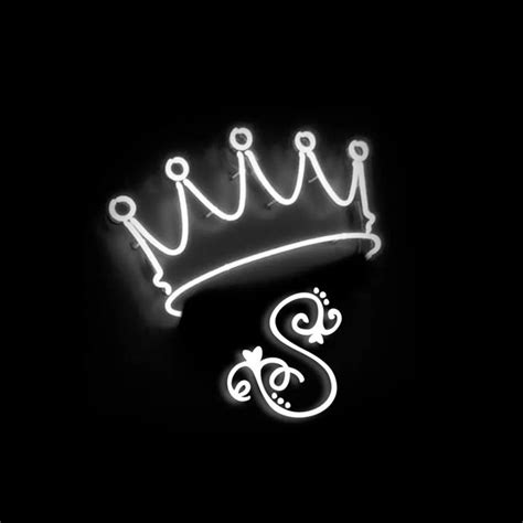 A Black And White Photo Of A Neon Sign With A Crown On It S Head