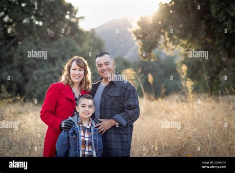 Mixed Race Family Portrait Outdoors Stock Photo - Alamy