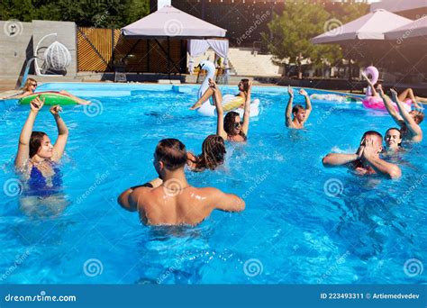 Multiracial Group Of Friends Having Party In Private Villa Swimming Pool Happy Young People In