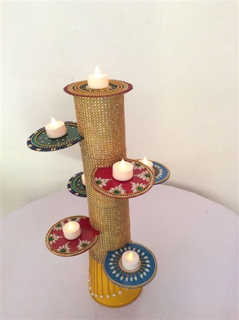 Three Candles Are Placed On Top Of Each Other In The Center Of A