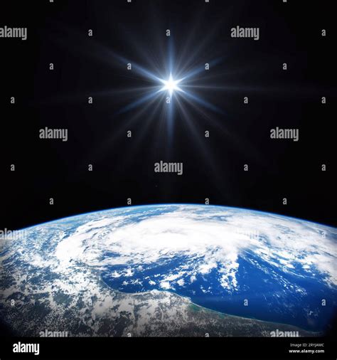 Bright star shines above the Earth in space. Birth of Jesus concept ...