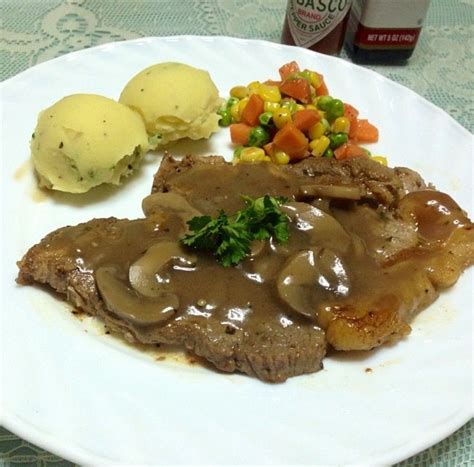 Porterhouse Steak With Mushroom Gravy Mashed Potatoes And Buttered Veggies