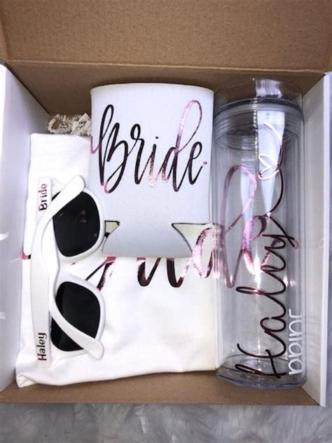 A Bride Gift Box With Sunglasses Coffee Mug And Napkin