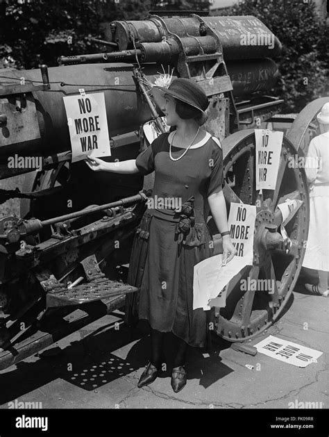 Woman Hanging No More War Signs on Military Artillery, USA, circa 1922 Stock Photo - Alamy