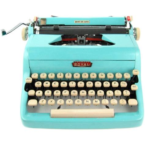 An Old Fashioned Blue Typewriter With Keys