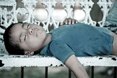 Mexican Child Sleeping On A Bench Valladolid Yucatan Mexico