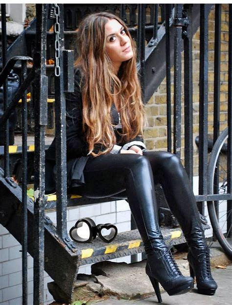 Cute Brunette In Black Leather Leggings And Ankle Boots