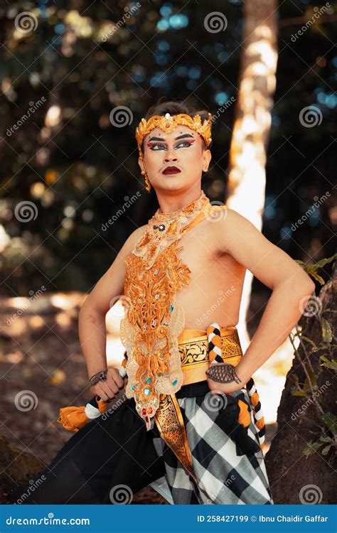 Balinese Dancer Performs the Dance in Golden Costume and Golden Crown ...