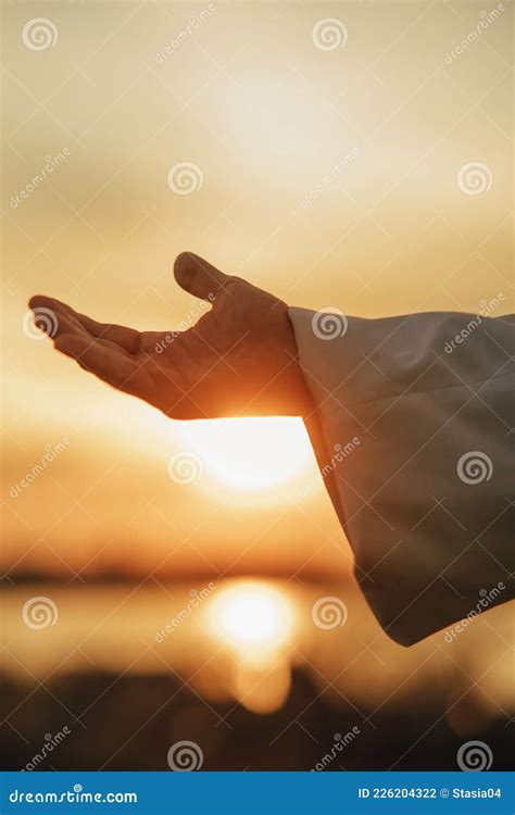 Jesus Christ Reaching Out His Hand At Sunset Stock Photo Image Of