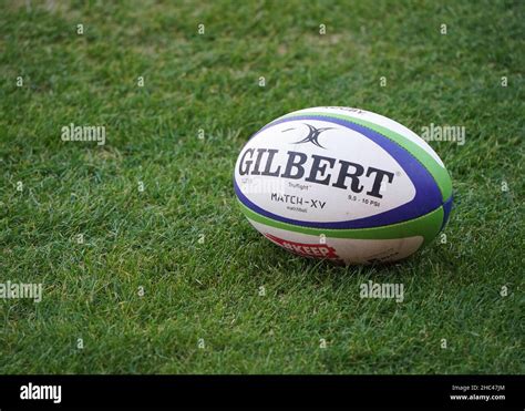 Gilbert rugby ball on pitch Stock Photo - Alamy