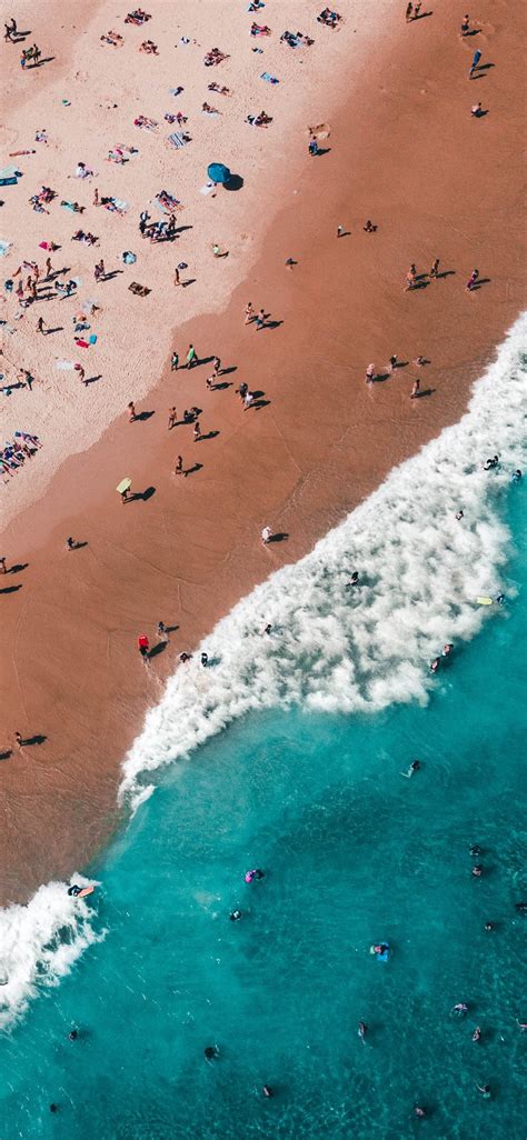 aerial photography of people on beach iPhone X Wallpapers Free Download