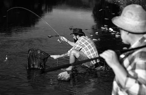 Premium Photo Fisherman Men Friends And Trophy Trout Father And Son