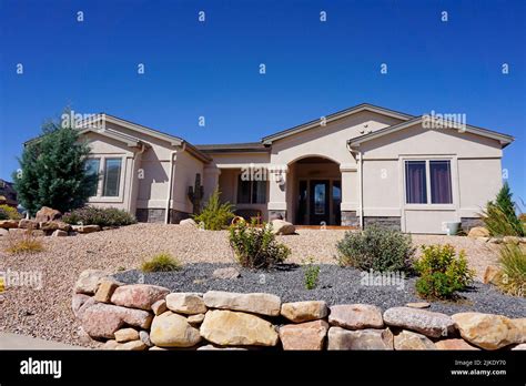 Modern stucco house with drought tolerant landscaping Stock Photo - Alamy