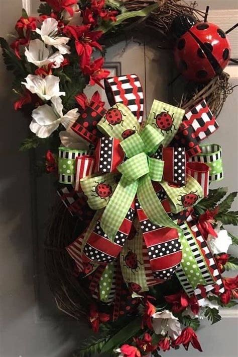 A Wreath With Ladybugs And Flowers On It