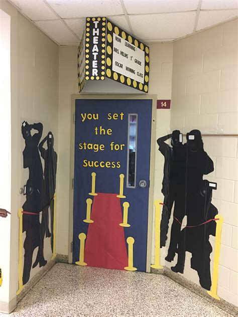 An Entrance To A Classroom Decorated With Black And Yellow Paper