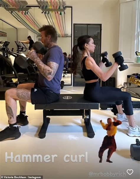 A Man And Woman Sitting On A Bench With Dumbbells In Front Of Them