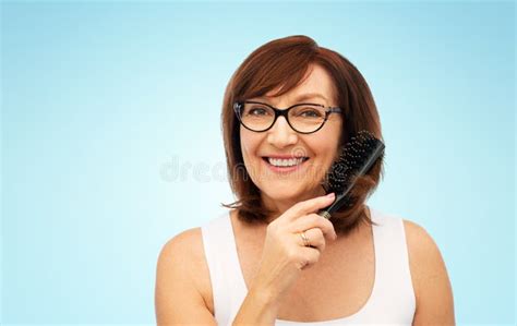 Portrait Of Senior Woman In Glasses Brushing Hair Stock Image Image Of Adorable Elder 140971173