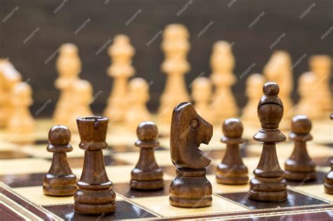 Premium Photo | The chess game pieces on a chess board