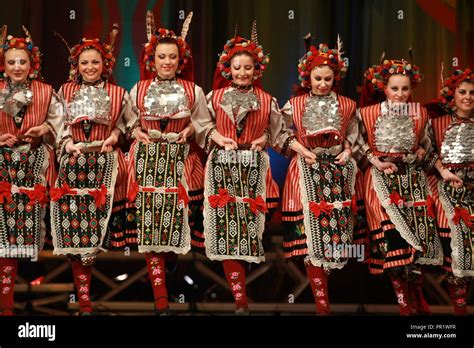 People In Traditional Folklore Costumes Perform Folk Dance Bulgarian