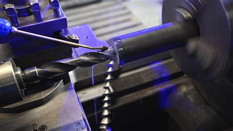 professional metal worker operating lathe machine custom metal