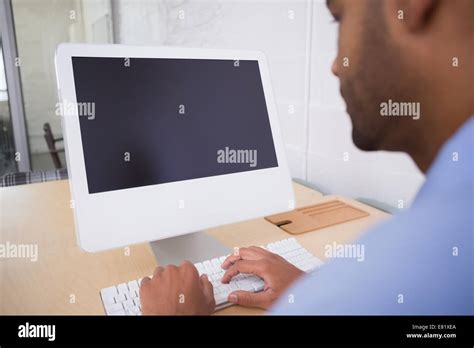 Businessman Using Computer At Desk Stock Photo Alamy