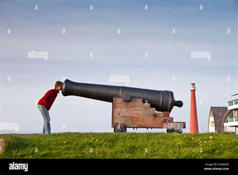 The Netherlands, Den Helder, lighthouse and cannon Stock Photo - Alamy