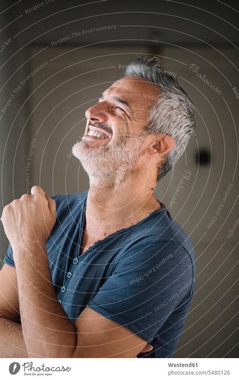 Portrait Of Happy Mature Man At Home A Royalty Free Stock Photo From