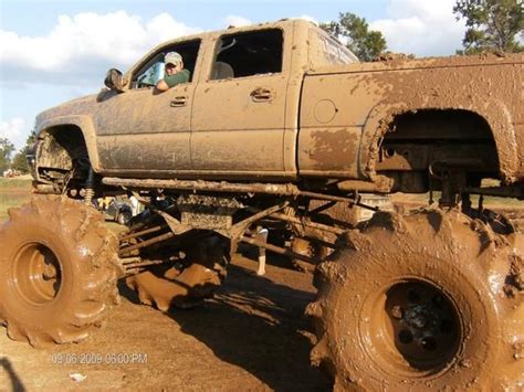 Muddy Jacked Up Chevy Trucks