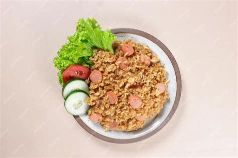 Premium Photo | Nasi Goreng Sosis is Fried Rice with Sausages garnished ...