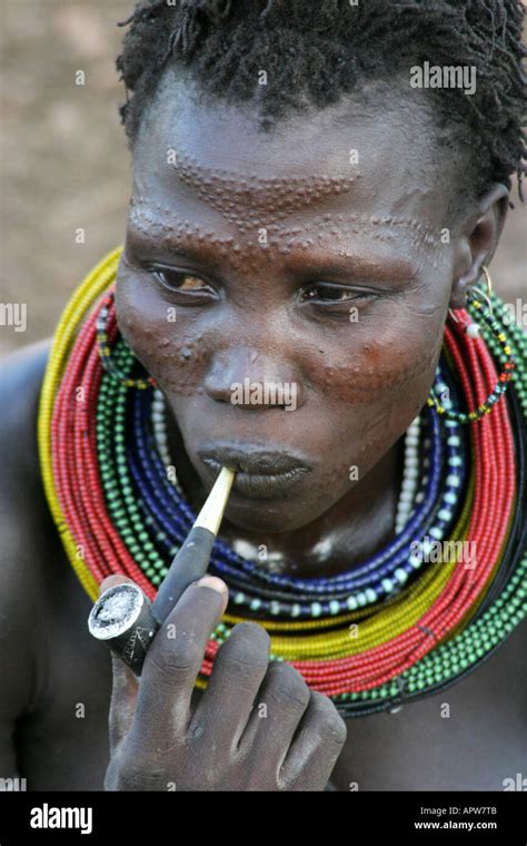 African women smoking pipe hi-res stock photography and images - Alamy